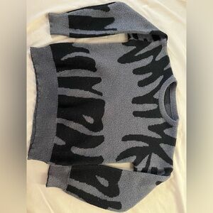 A black and gray crewneck